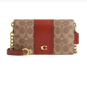 COACH 
Signature Coated Canvas Crossbody Bag